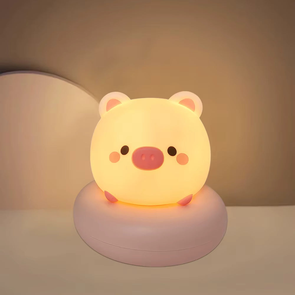 Veilleuse LED pour bébé en forme de cochon diffusant une lumière douce et apaisante